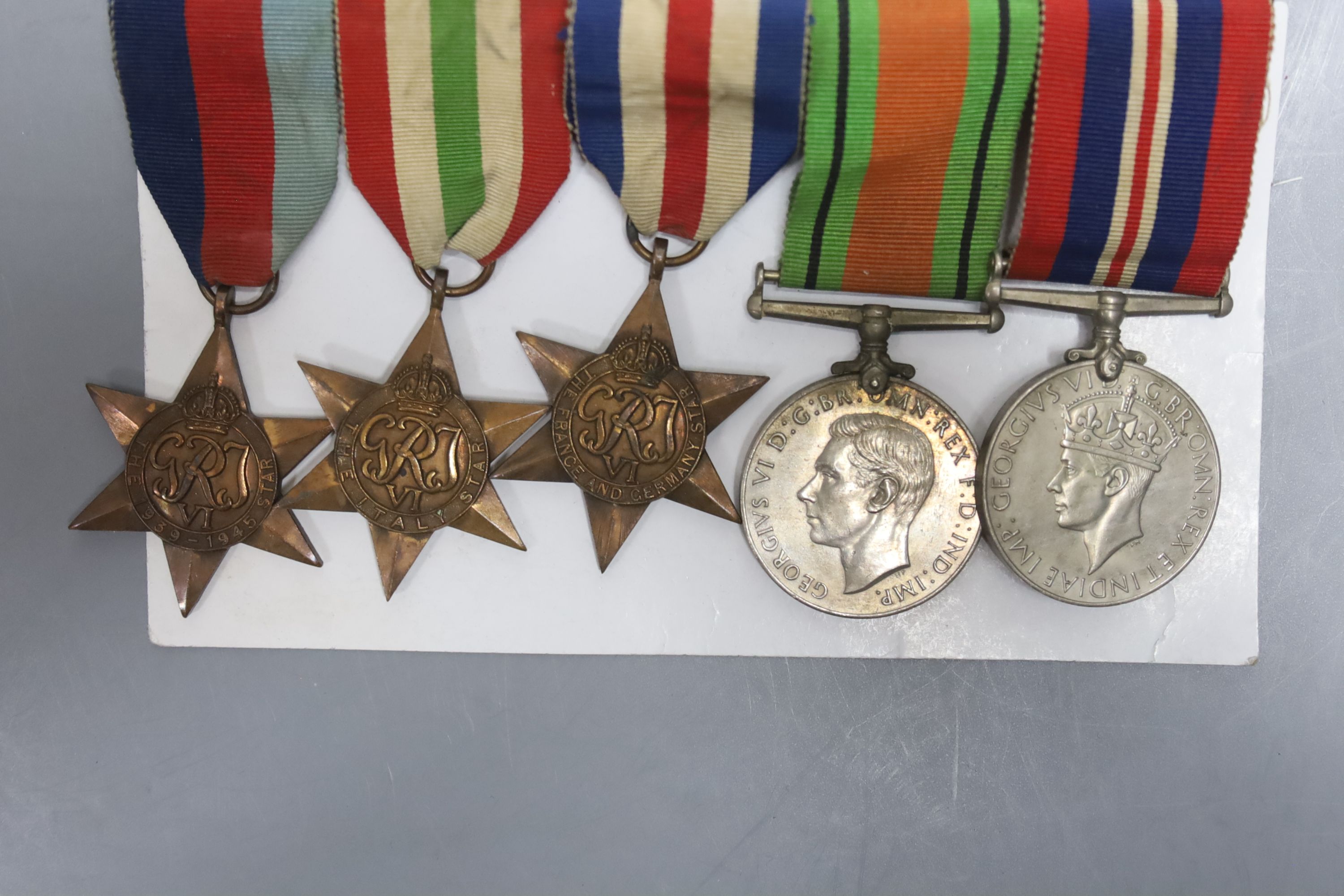 WWII medal group comprising 1939-1945 Star, the Italy Star, the France and Germany Star, Victory in Europe and Defence medal (5)